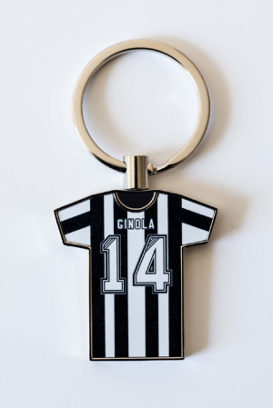 Keychain shaped like a black-and-white striped jersey with the name GINOLA and number 14 on it, attached to a metal ring.